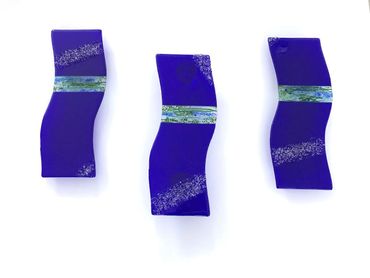 Blue fused glass tryptic wall sculpture.