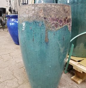 light blue concrete indoor and out door pot approximately 3 feet high