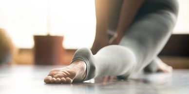 Student practicing yoga  in a low lunge stretch