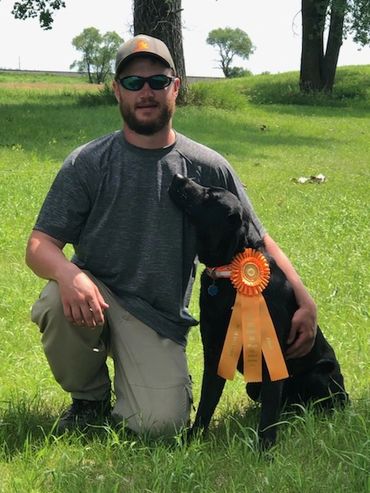 black dog with ribbon