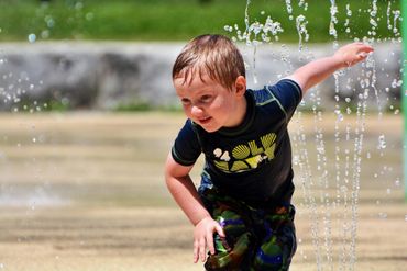 Boy
Splash pad
Summer
Water
Fun