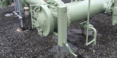 Double Bolt Quick Opening Closure on pipeline launcher. Shown with optional chain and sprocket drive