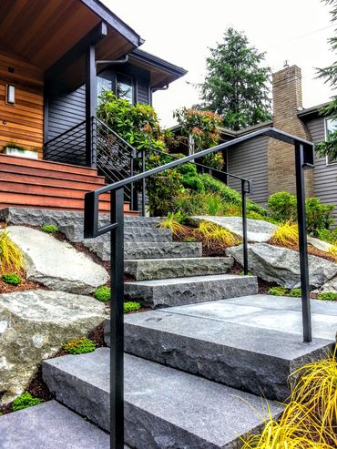 Contemporary exterior hand railing solid steel construction with matching porch guard railing