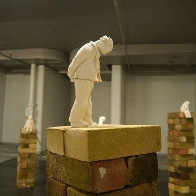 statue of a man walking and thinking at the same time