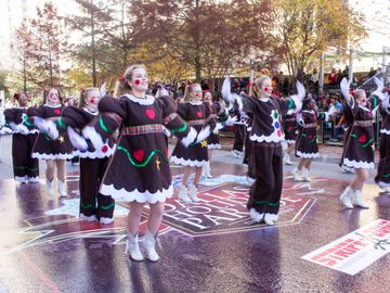 Adorable costumes, rosy cheeks, and huge smiles marching down Commerce Street