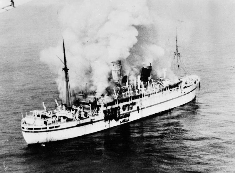 The Empire Windrush on fire, 1954.