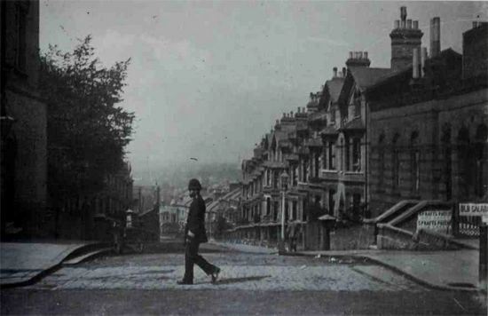 Just a street or two away from Jasper Road is Woodland Road, and Zola photographed this with a polic