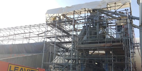 Scaffolding over a concrete batch plant for winterization. Kamloops Scaffold & Shrinkwrap.