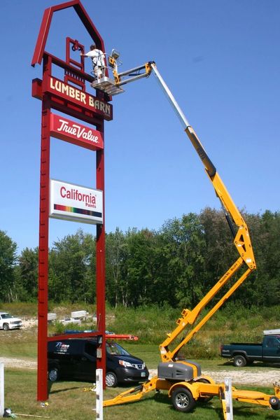 Painting in a high location from a lift.