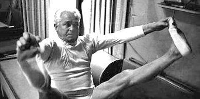Open leg rocker by Joseph Pilates