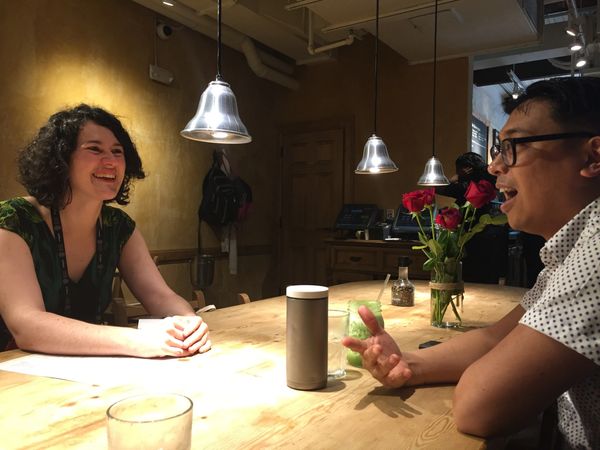 A man and a woman talking over a table
