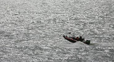 Columbia River Bassmasters running in choppy water on the Columbia River.