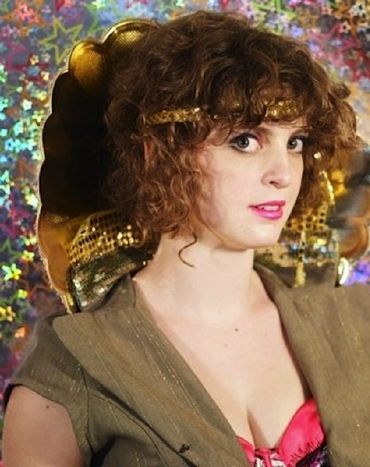 ADIRA AMRAM is a multidisciplinary performer, a comedian, singer/songwriter, dancer, choreographer a