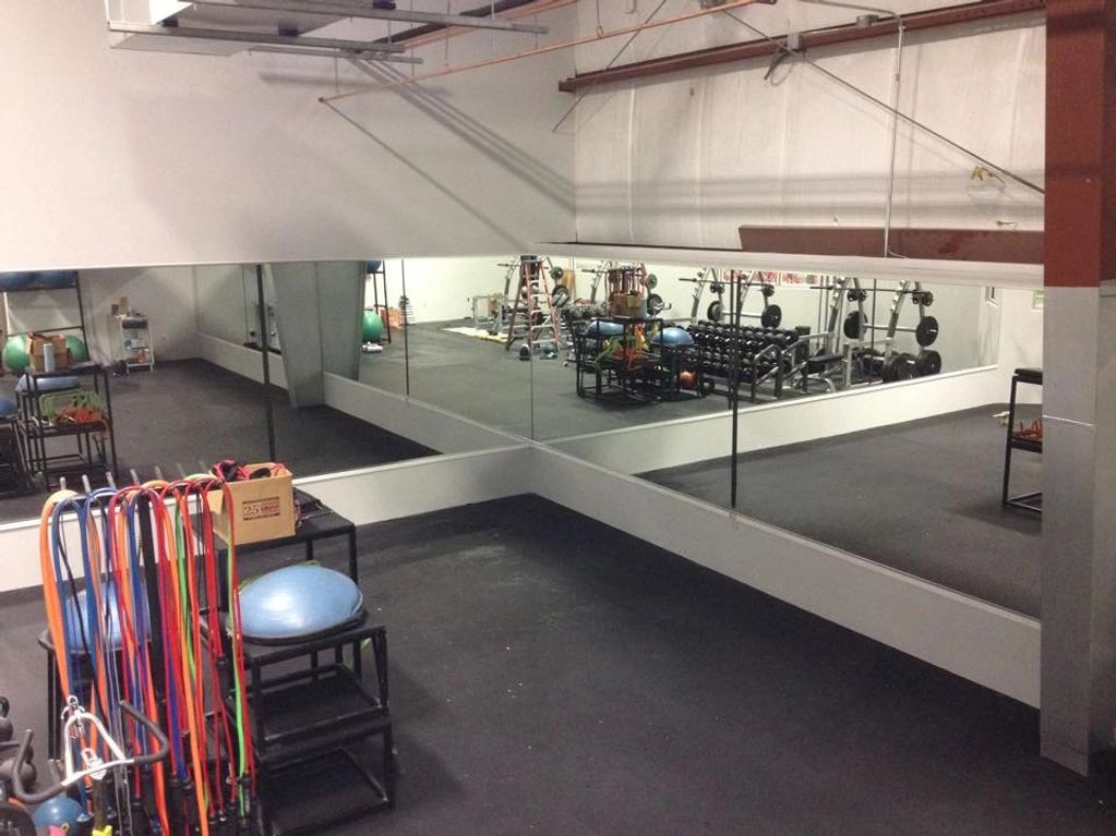 Custom Mirror walls installed in a gym