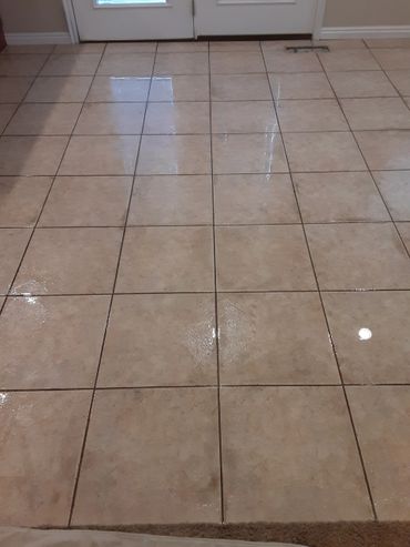 A Tile floor that is being pre-sprayed to lift soil before the extraction process