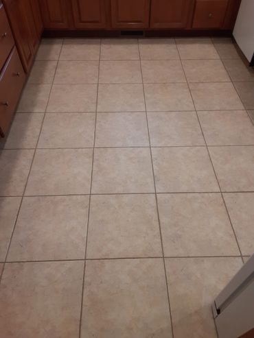 The final product, a clean, sealed tile floor
