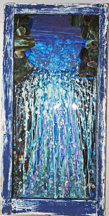 Water Falls is a mosaic wall art made with tempered glass and stain glass which shows a colorful wat