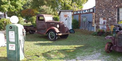 A photo opportunity with an old car and antique gas pump in front of a motel. Cuba, Missouri on Route 66.