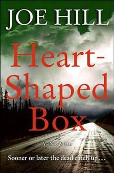 Book cover of 'Heart-Shaped Box' by Joe Hill with a dark, stormy road scene.