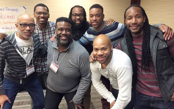 A group Jamie and Vernon pose for a photo with SJTI participants.