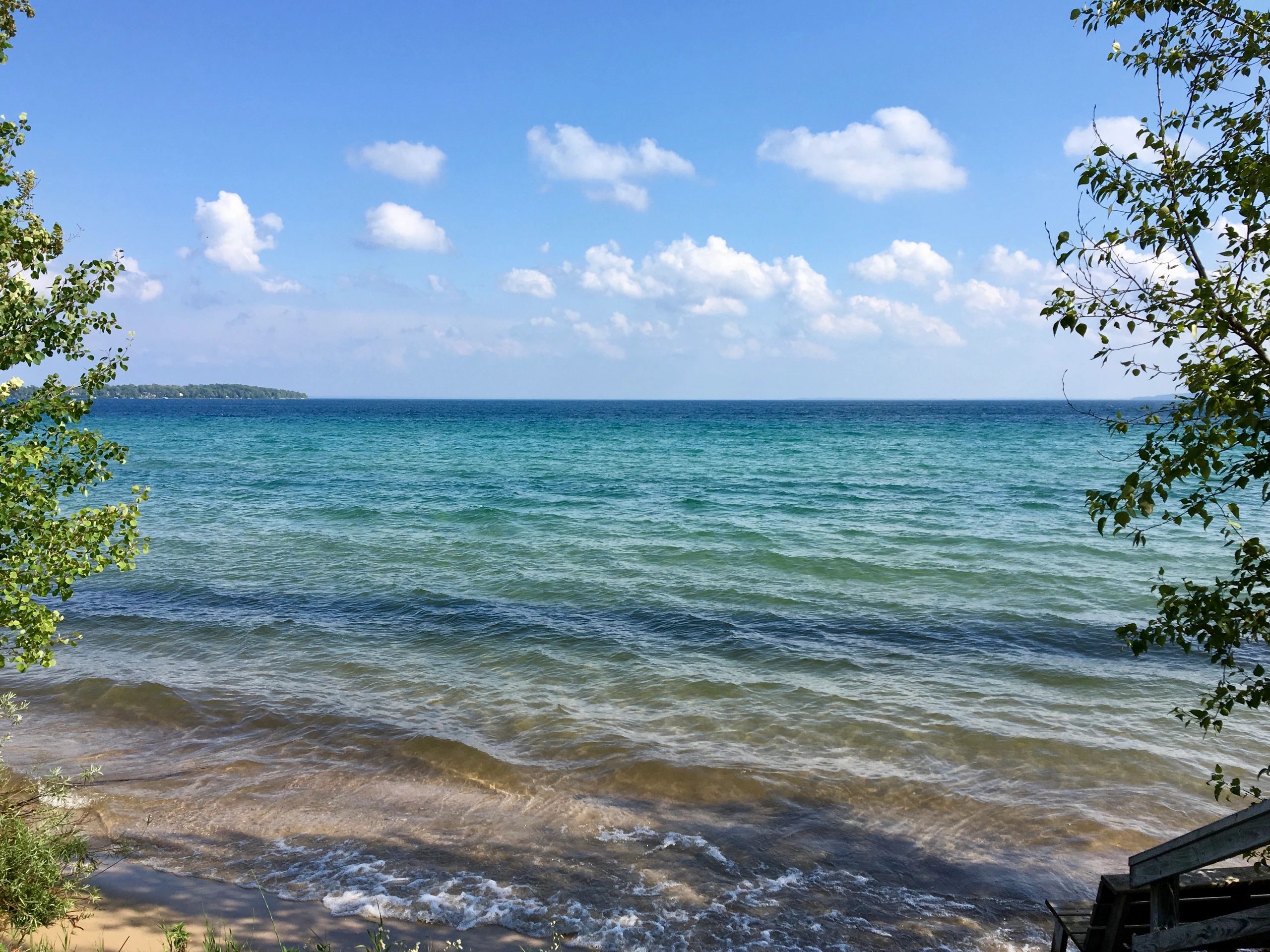 Grand Traverse Bay, Lake Michigan, a source of inspiration for our car window decals, hats, shirts.