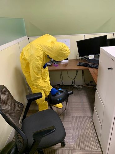 Technician disinfecting in office building for Coronavirus Covid19 pandemic.