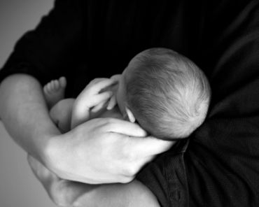 "When you hold an infant, hold him not just with your body, but with your mind and heart." ~Magda G
