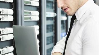 A man working in a database room
