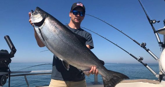 Blake with a nice king on a recent charter out of Two Rivers.