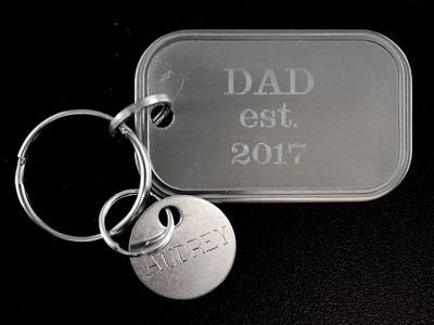 Rotary engraving on metal key fobs.
