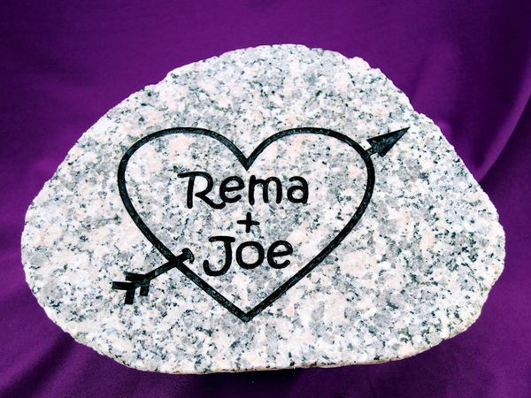 Engraved river rock with heart and initials for an anniversary gift.