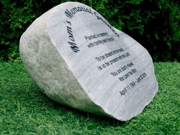 Side view of memorial stone showing the angled polished engraved face.