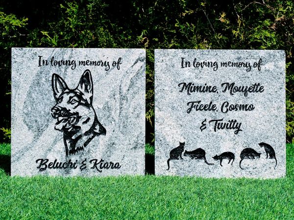 Two engraved granite pet memorial pavers.