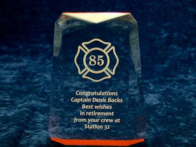 Reverse laser engraving on acrylic award.