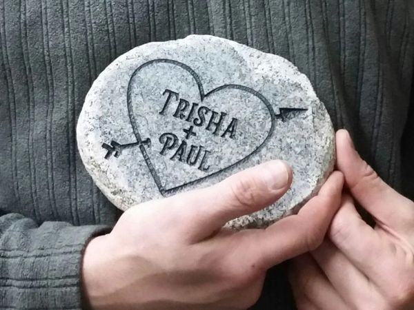 Engraved stone showing heart and iniitials