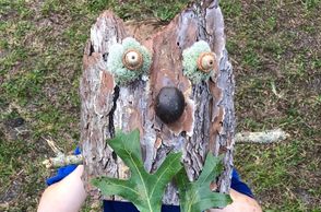 child holding bark mask