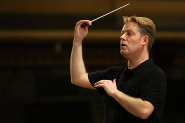 Conductor Andrew Wailes in rehearsal at St Paul's Cathedral