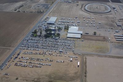 Arial photo of property with cars.