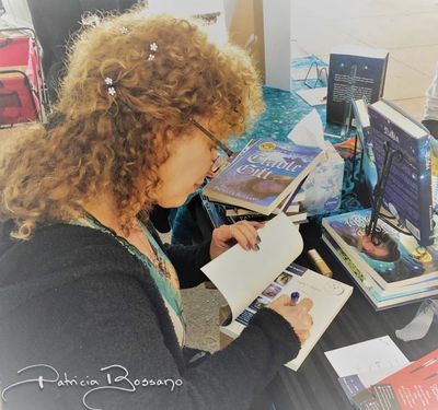 Patricia Bossano signing books at Bay Area Festival of Books, author pavilion