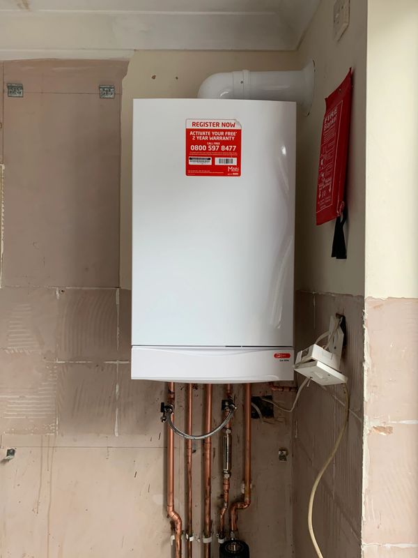 mains combi condensing boiler fitted with a new central heating radiators and scale inhibitor filter