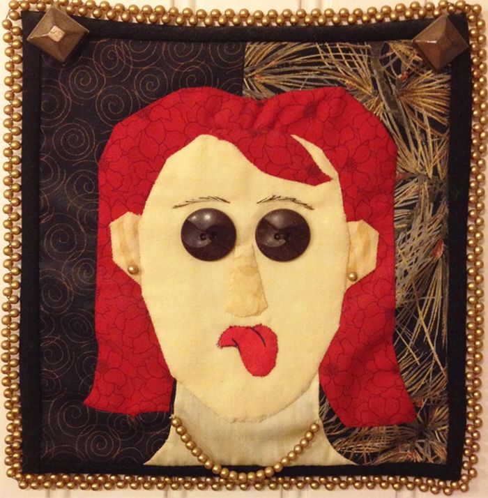 This is Jen's first quilt. It measures about 7" square. It's a self portrait but as a redhead