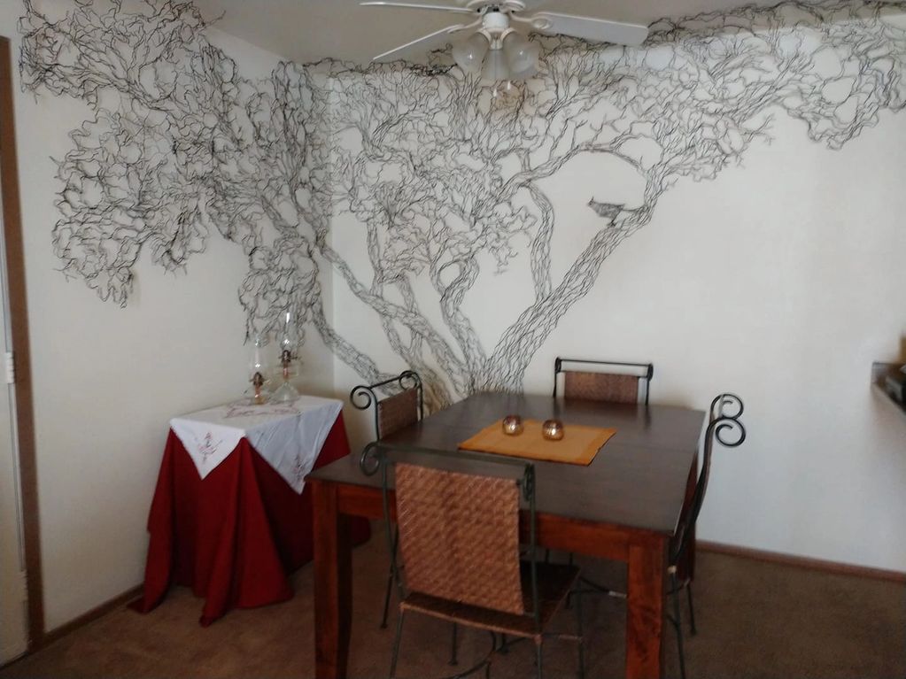 Mystery Tree, wire wall art, customized to wrap a corner for a unique and intimate dining experience