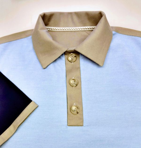 Close up of inset placket collar of a henley style shirt