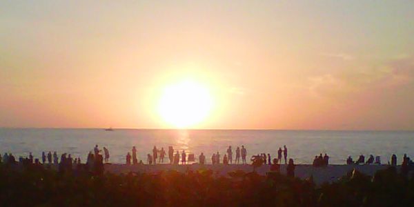 People watching sunset on the beach