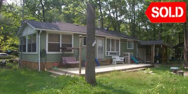 Sold at Real Estate Auction by North American Auctioneers