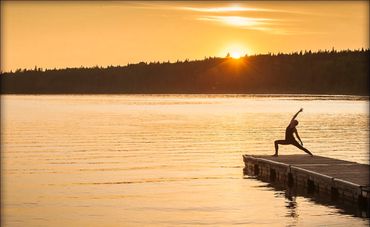 Yoga on a dock in riding mountain national park