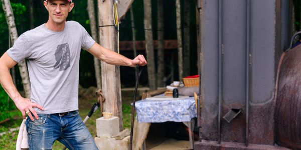 Cecil Abels III tending the smoker