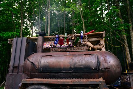 Lang 84" BBQ smoker in New Hampshire with bottle tree ironwork