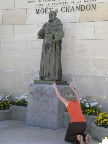 Paying homage to an idol (Dom Perignon) at the beginning of a trip to France.