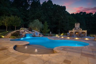 <img src="pool.jpg" alt="pool at night with outdoor fireplace">